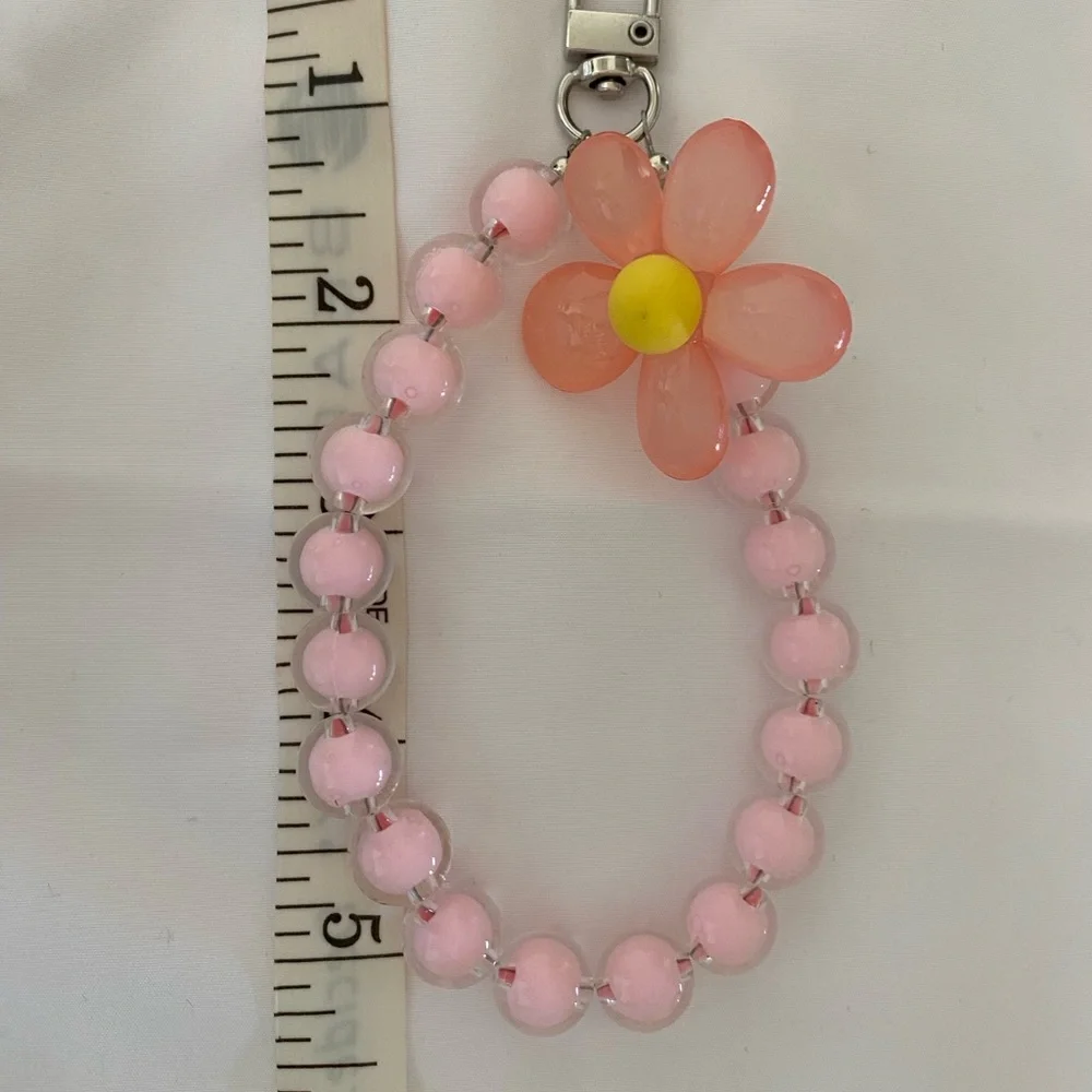 1-wrist lanyard for cells, keys and more Pink Oversized Flower Charm